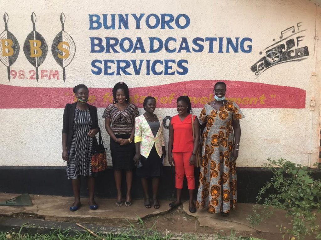 The head of the women defenders with disabilities, a female journalist based in Masindi with the Bunyoro Broadcasting services and  the regional focal person pose for a photo.