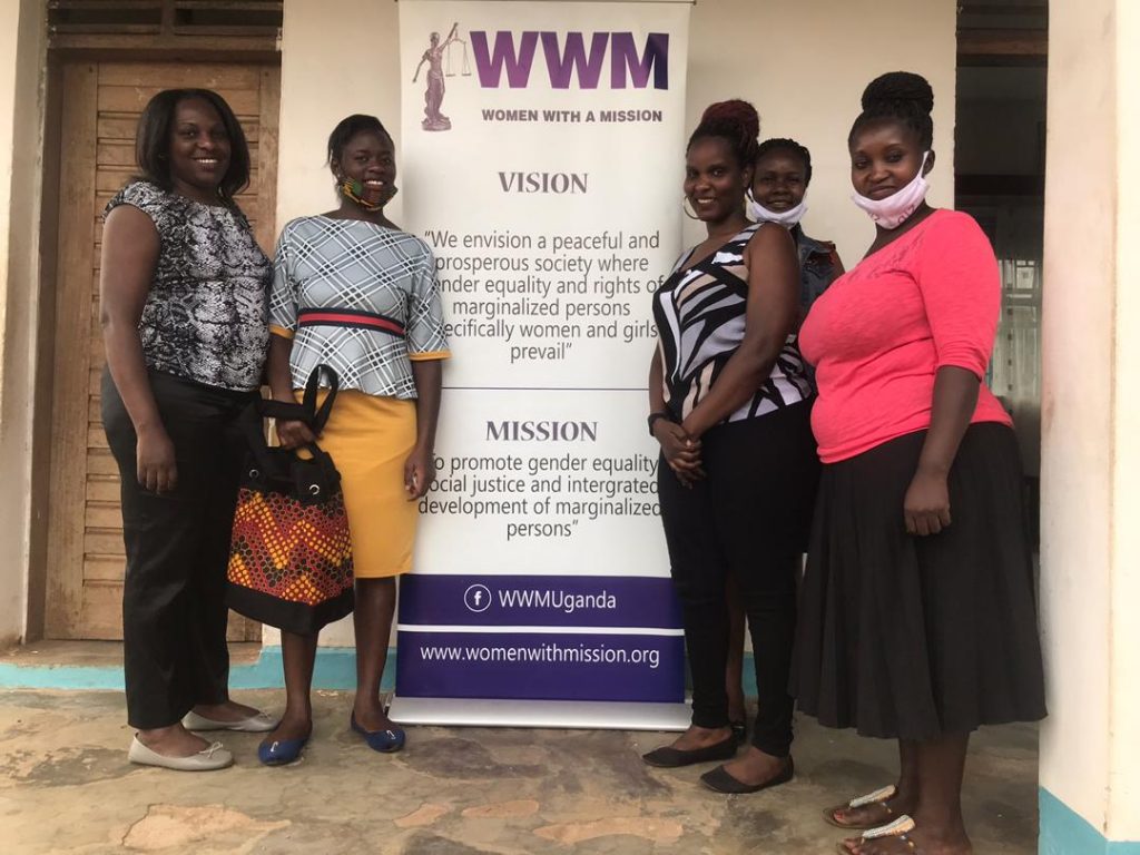 WHRDNU staff poses for a photo with WHRDs from Women With A Mission in Mbale district.