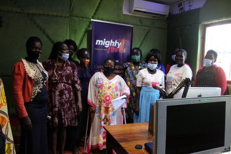 Members of the Acholi Regional Network of WHRDs pose for a photo after the radio talk show at Mighty Fire FM in kitgum district.