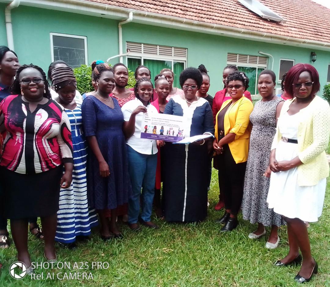 Acholi WHRDNU Network members present MP Betty Aol a position paper