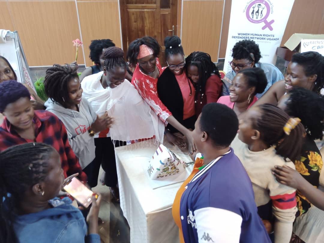 WHRDs cut cake during self care workshop
