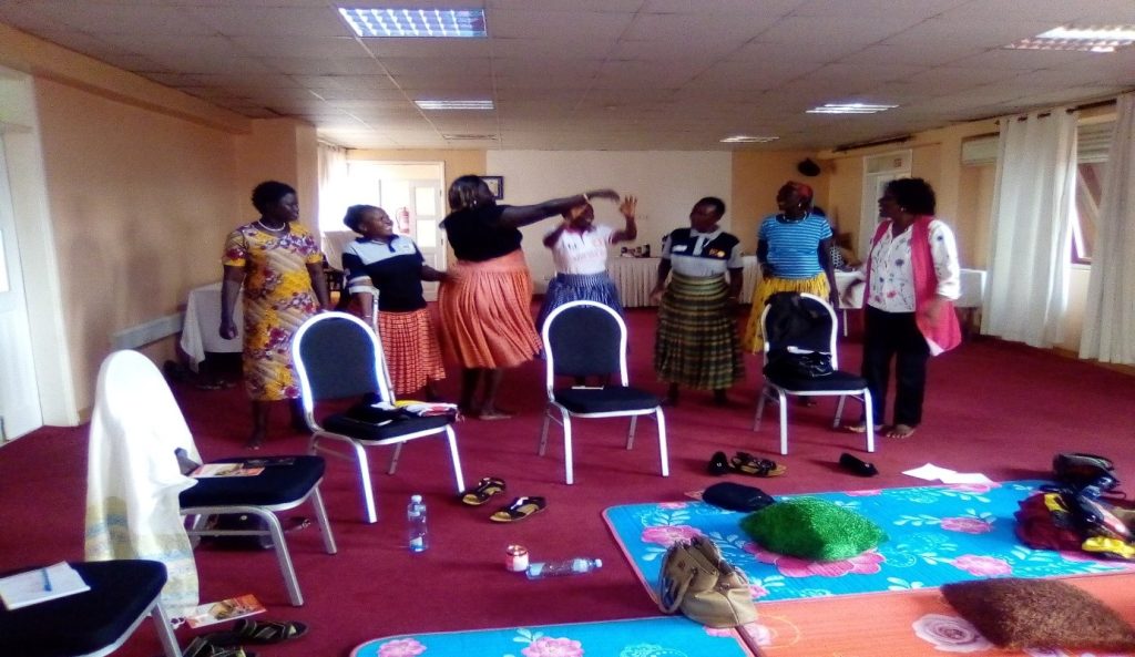 Amudat WHRDS dancing and enjoying during the self care workshop