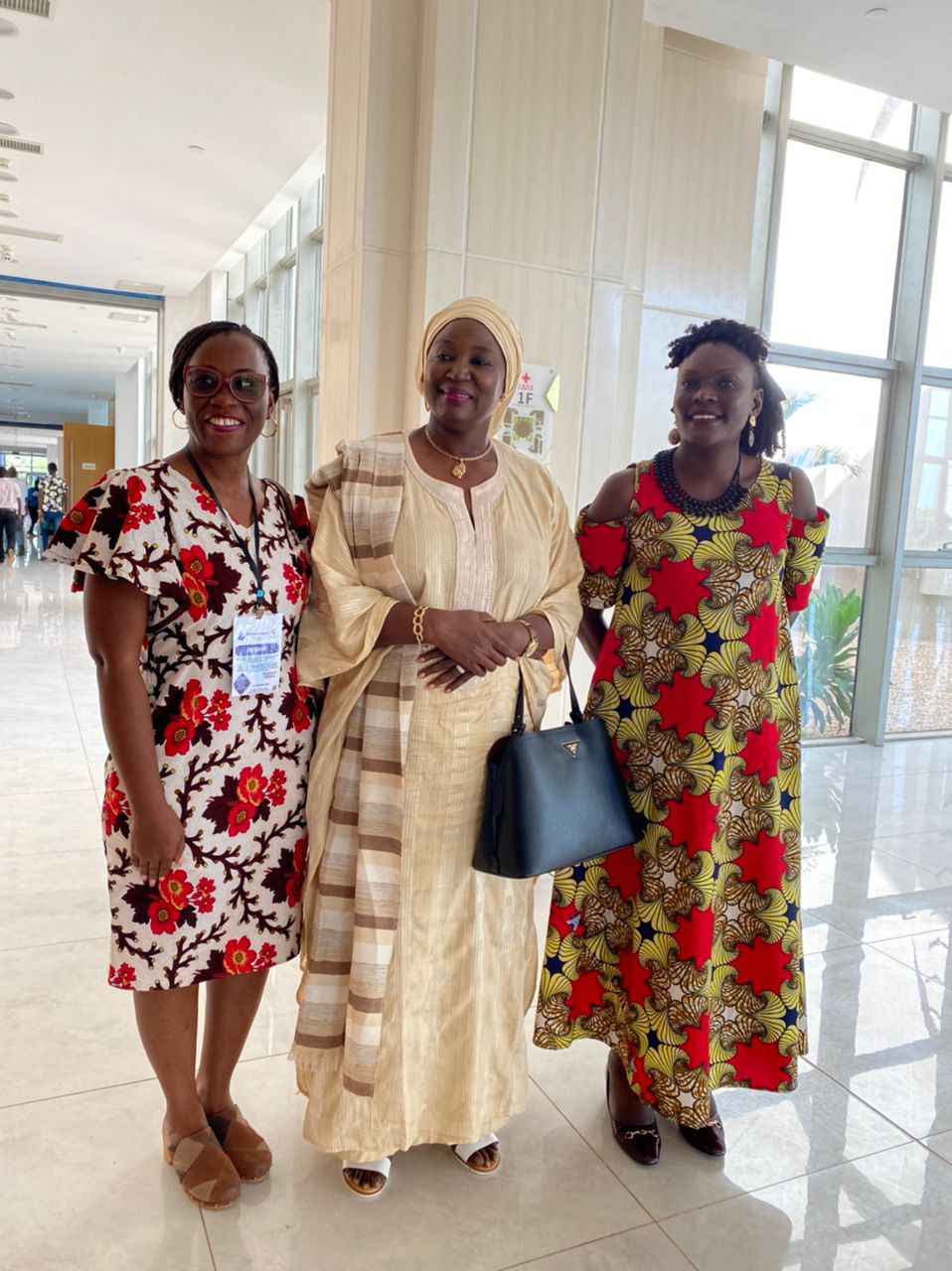 The Special Rapporteur on Rights of Women In Africa, Ms.Janet Ramatoulie Sallah-Njie ( center), pose for a photo with Brenda Kugonza, Executive Director-WHRDN-U (right